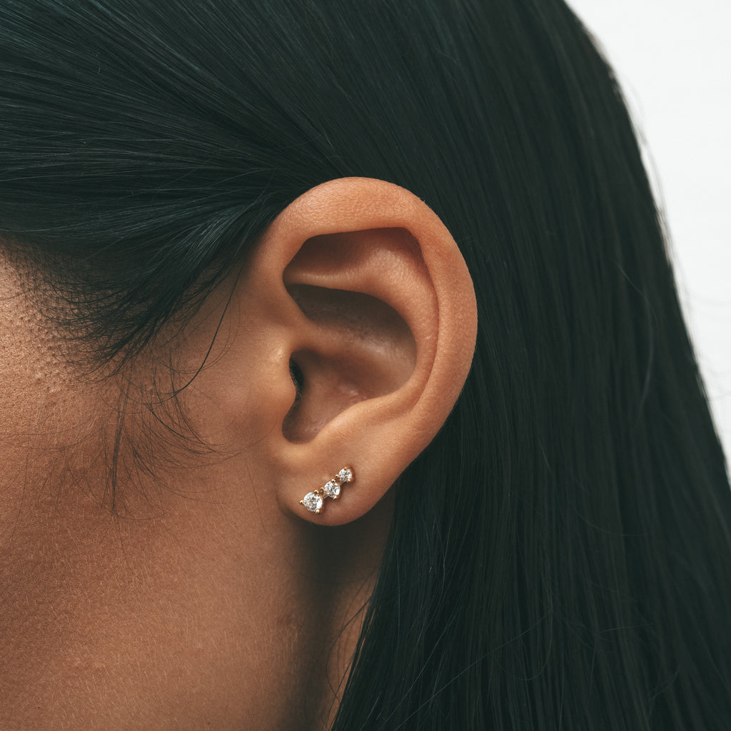 Close-up shot of a woman's ear with Sceona Karasuba studs earrings on
