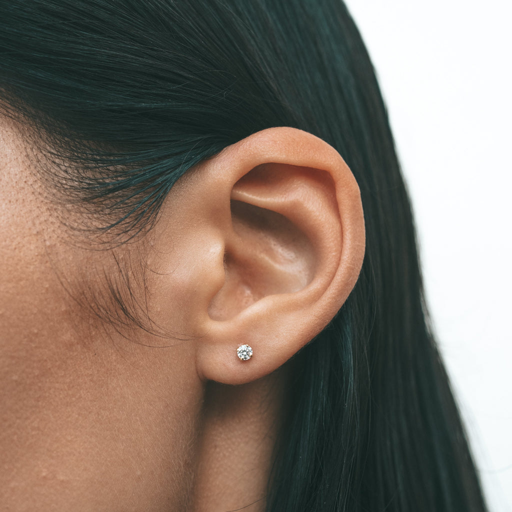 Close-up shot of a woman's ear with Sceona Inula studs earrings on